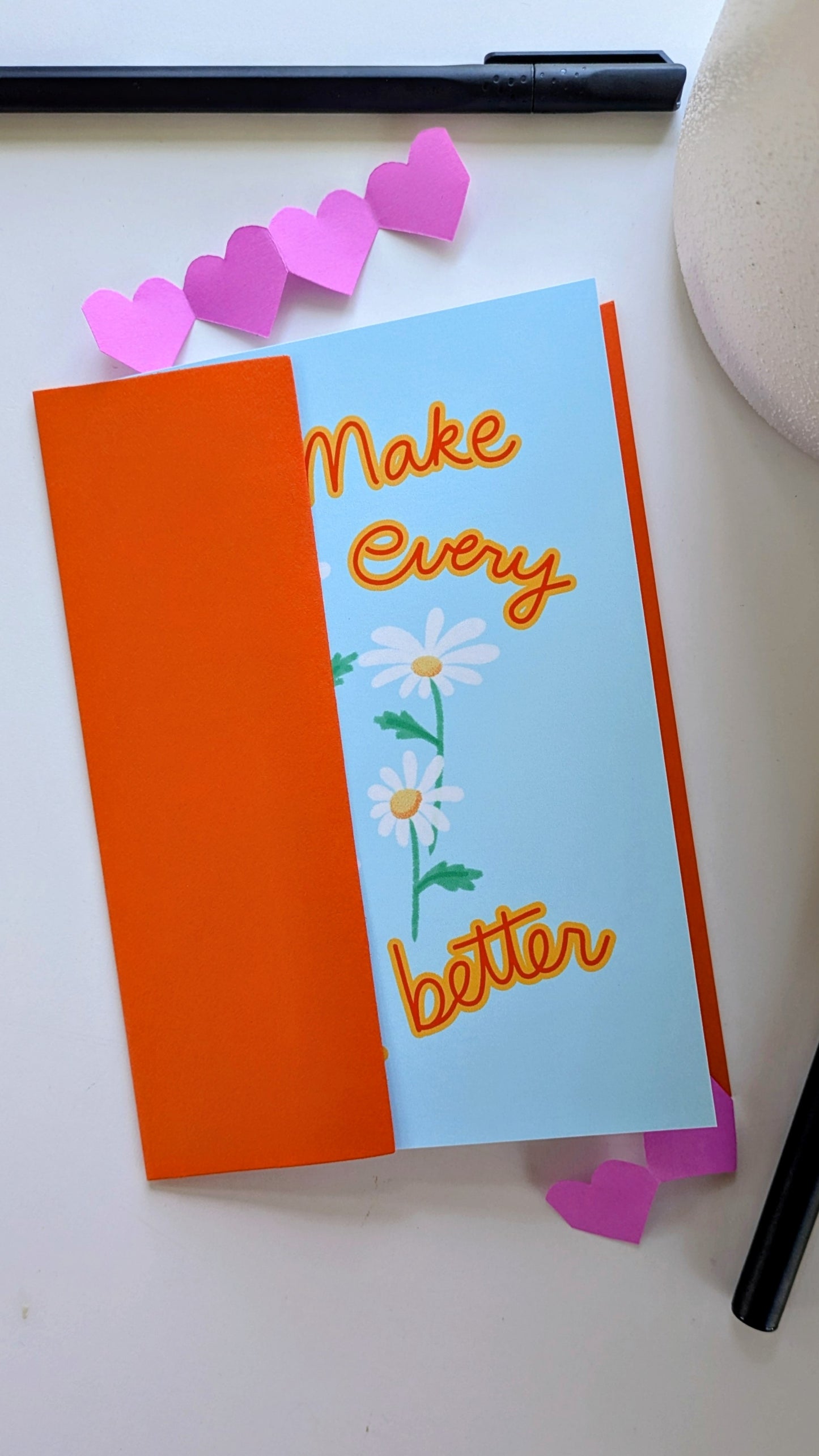 Floral nature art print featuring the phrase "No Enemy But Apathy" surrounded by colorful botanical illustrations, featuring orange envelope
