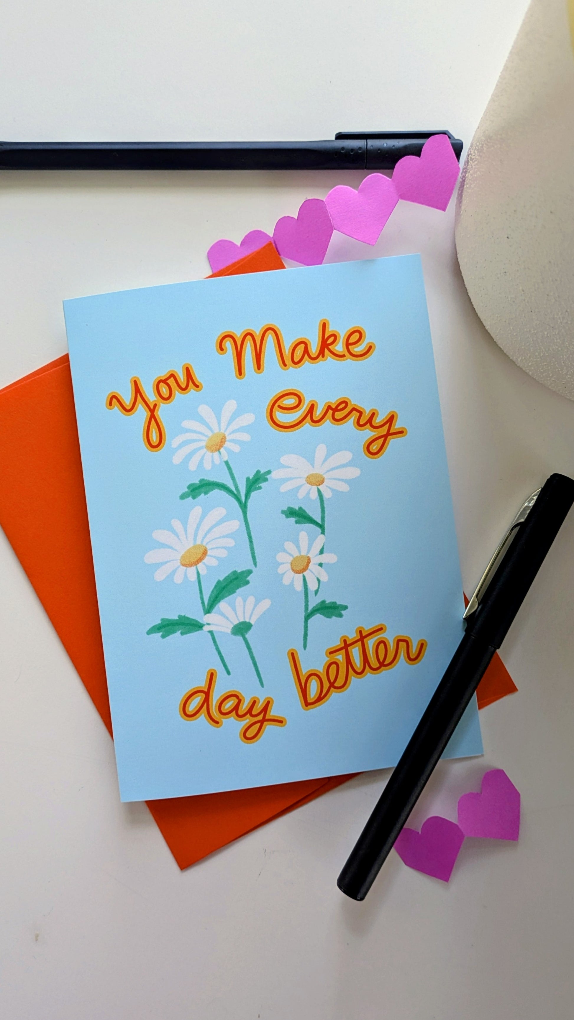 Illustrated daisy greeting card featuring white daisies and a handwritten message.