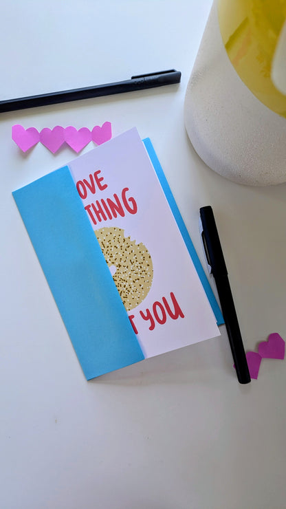 Illustrated greeting card featuring an everything bagel with the message "I love everything about you," including envelope