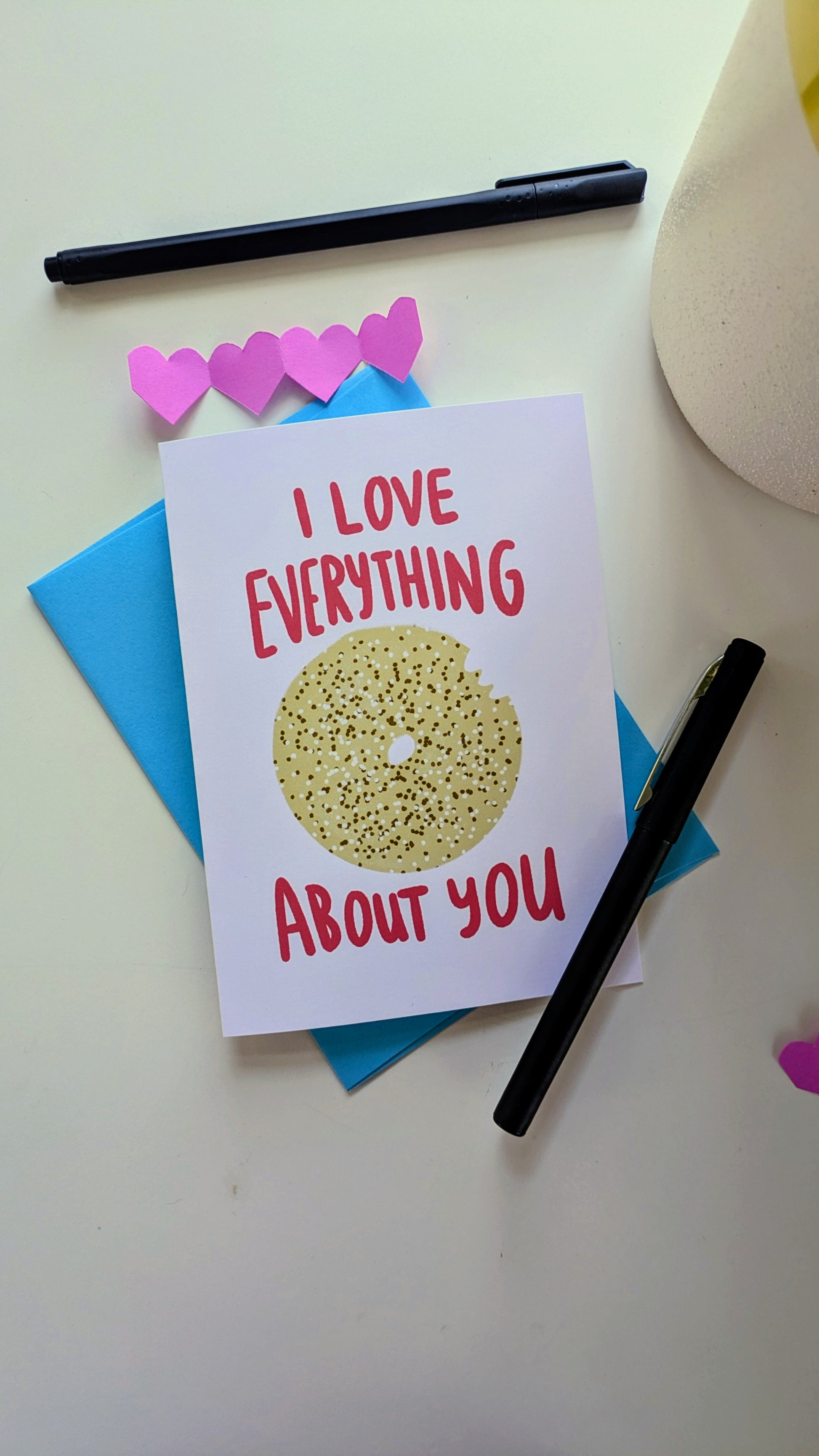 Illustrated greeting card featuring an everything bagel with the message "I love everything about you"