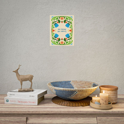Floral nature art print featuring the phrase "No Enemy But Apathy" surrounded by colorful botanical illustrations, hanging on an office wall