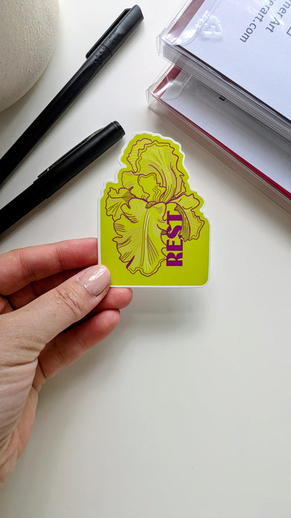 Rest floral sticker held by a hand next to notecard sets