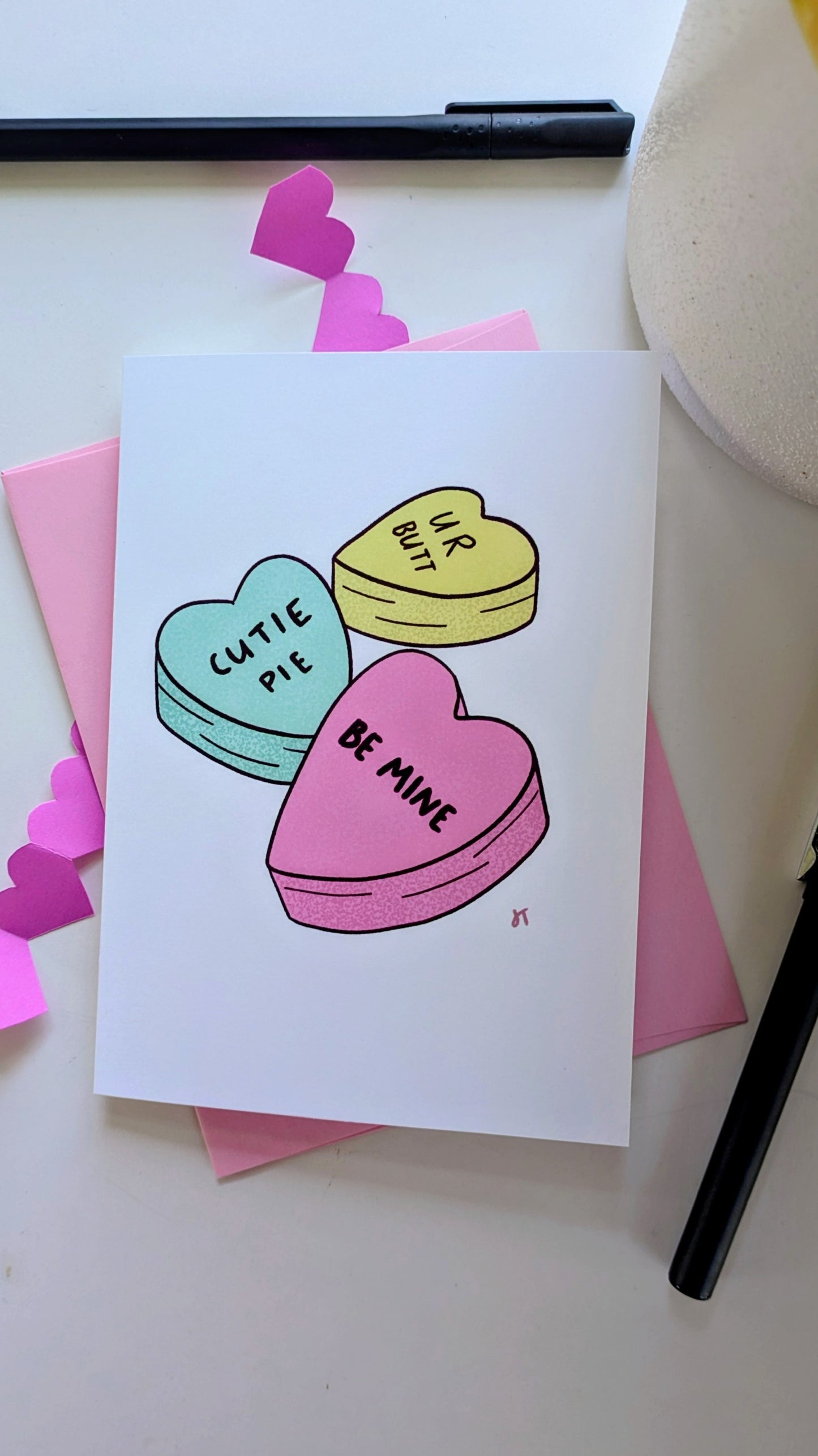 Valentine's Day illustrated greeting card with colorful candy hearts featuring playful love messages.